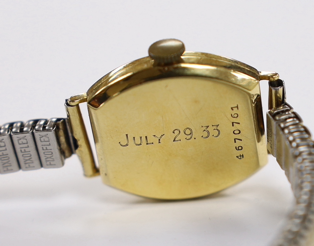 A lady's 1930's 18ct gold Longines manual wind wrist watch, with case back inscription, on a later associated steel and gold plated flexible strap.